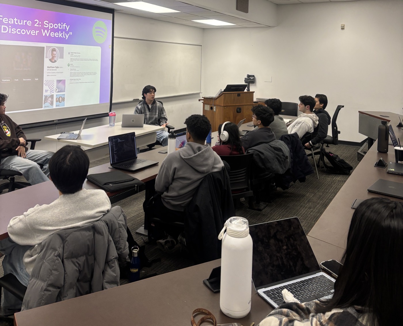 A member presenting a feature teardown at a weekly workshop